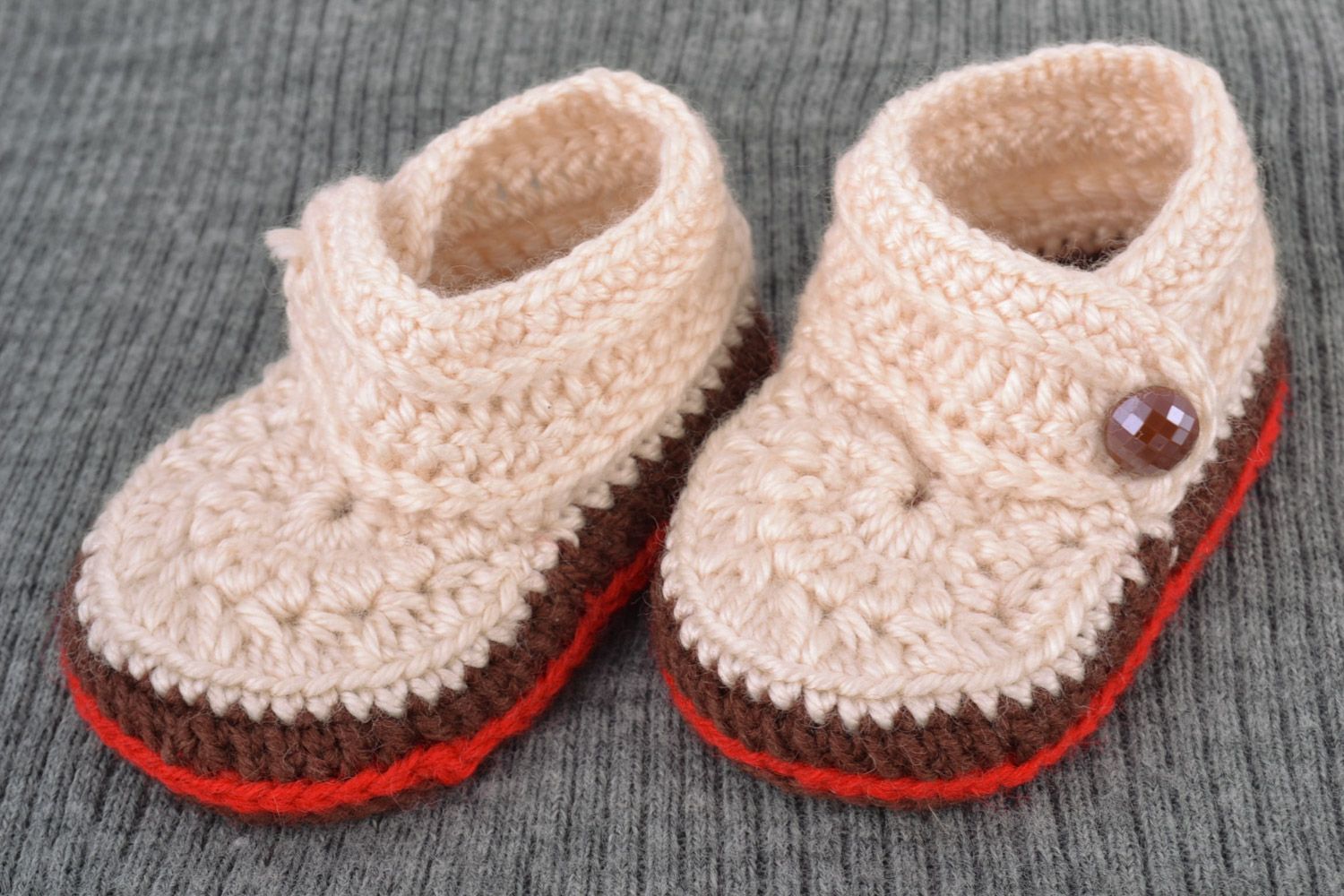 Light handmade knitted wool baby booties with beads and brown outsole photo 1