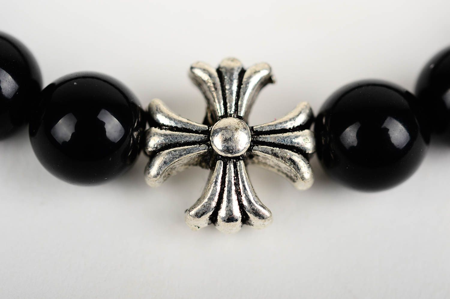 Metal cross and black beads unisex bracelet on an elastic string photo 4