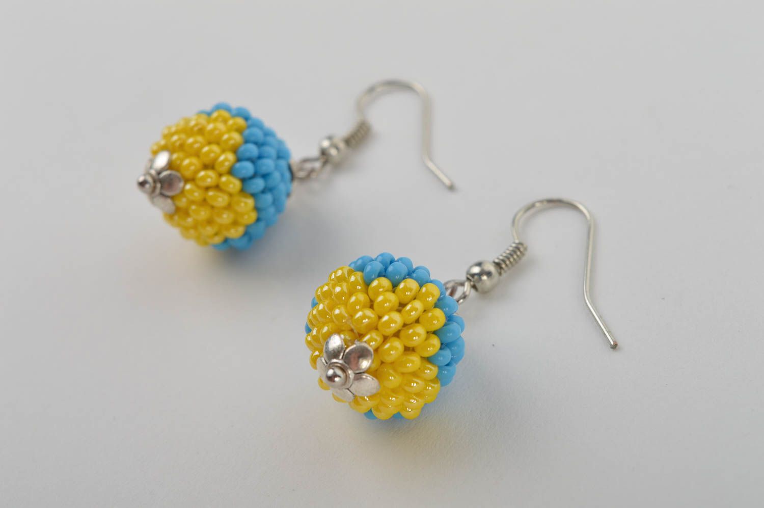 Handmade ball shaped dangle earrings woven of blue and yellow Czech beads photo 3