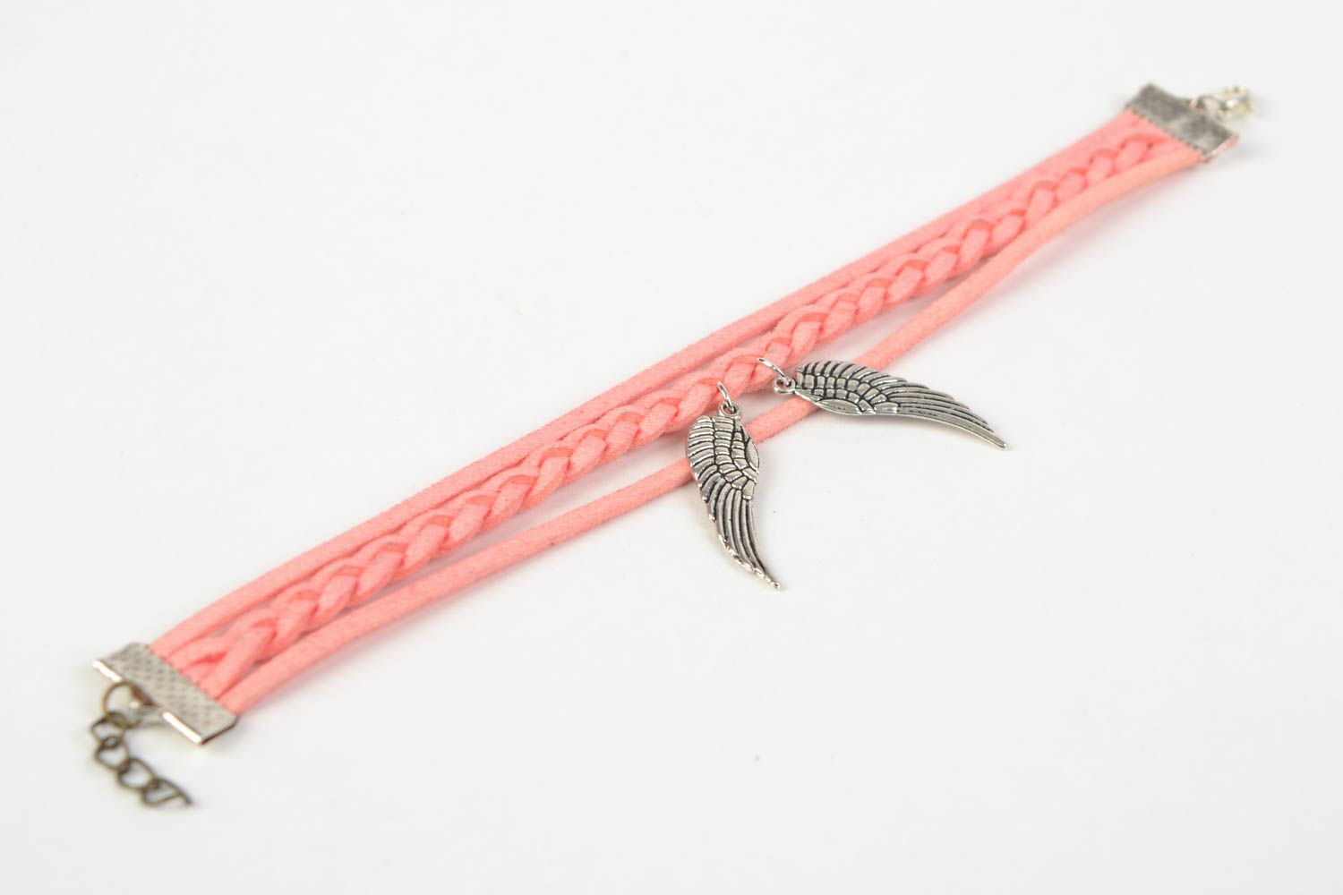 Pink handmade woven suede bracelet with metal charm in the shape of wings photo 5