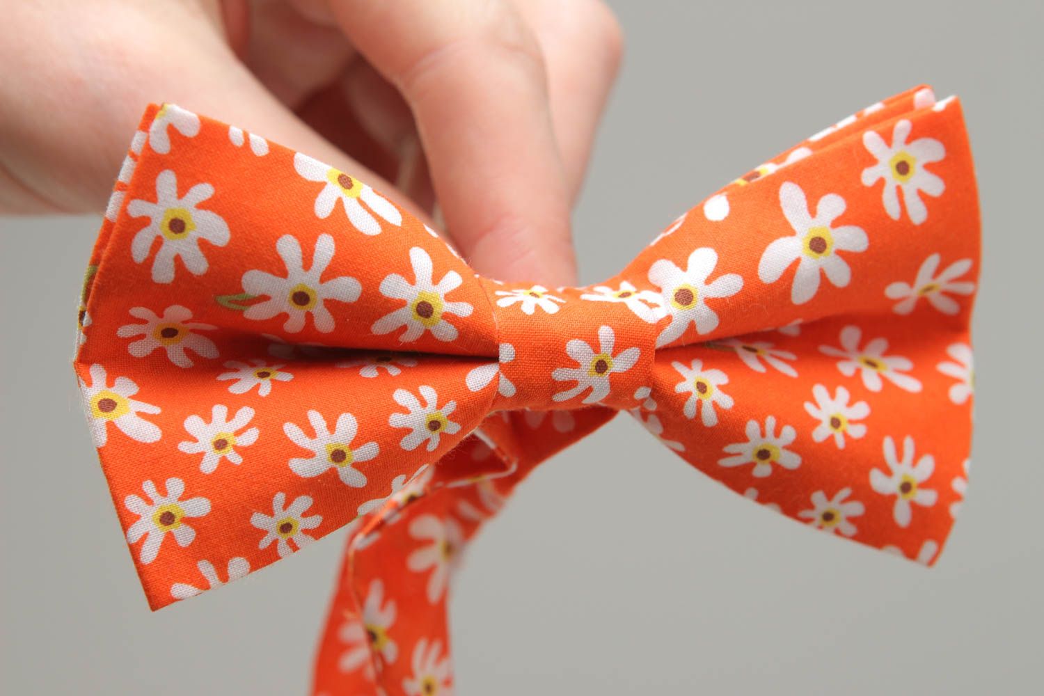 Orange fabric bow tie with floral pattern photo 4