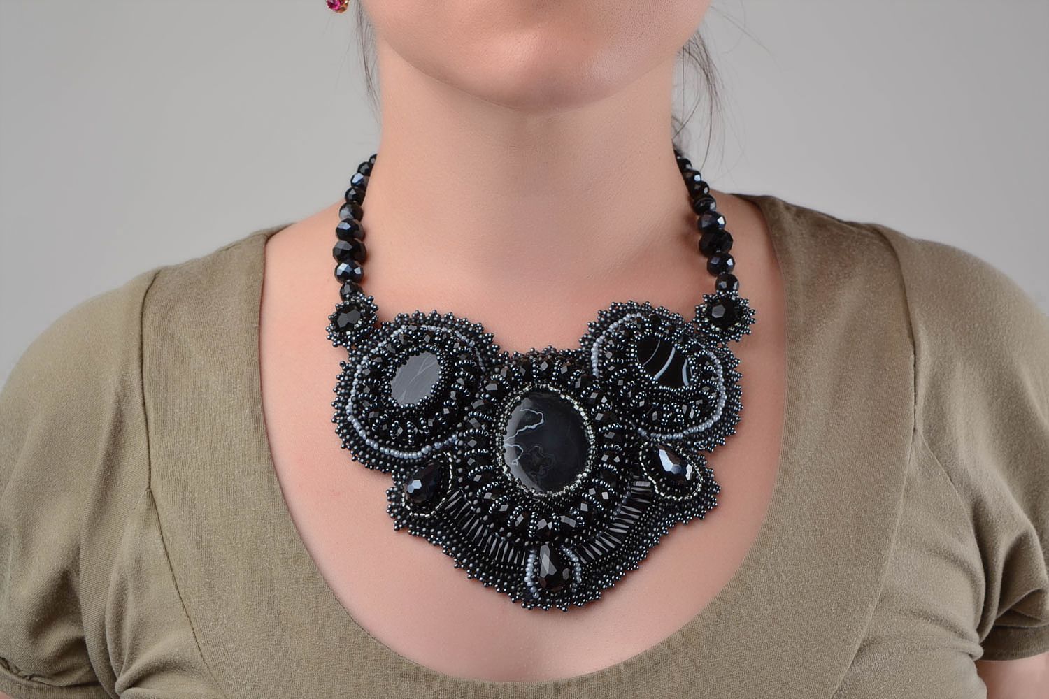 Handmade unusual beautiful black necklace made of leather and natural stones photo 1
