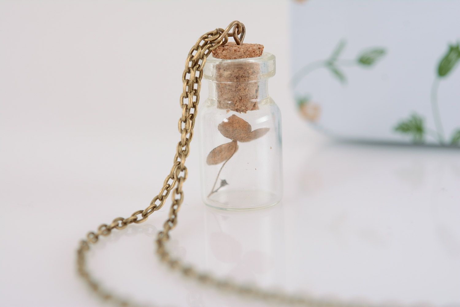 Small handmade glass vial with cork pendant with plant inside on metal chain photo 3