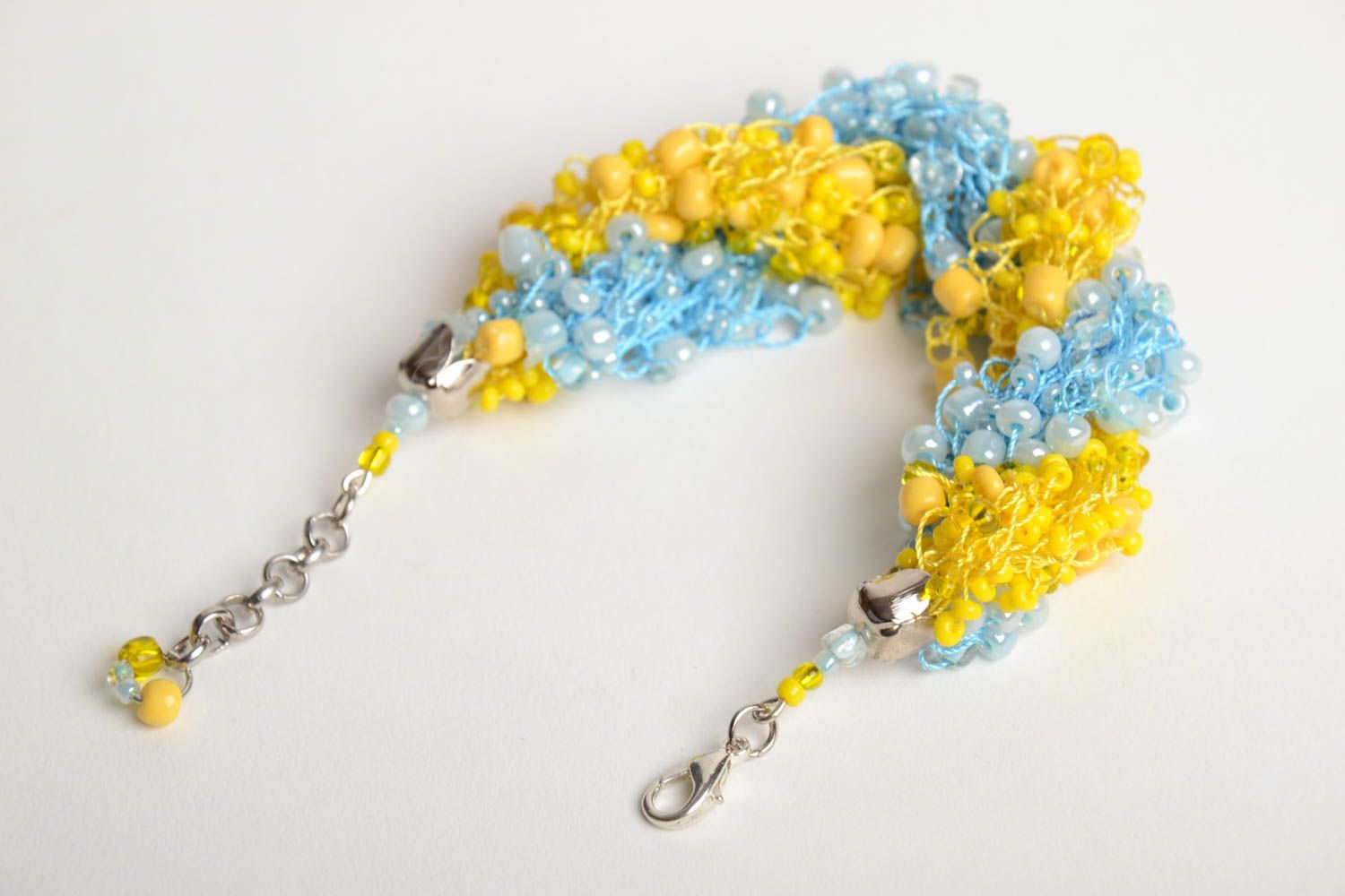 Bright handmade woven wrist bracelet crocheted of blue and yellow Czech beads photo 3