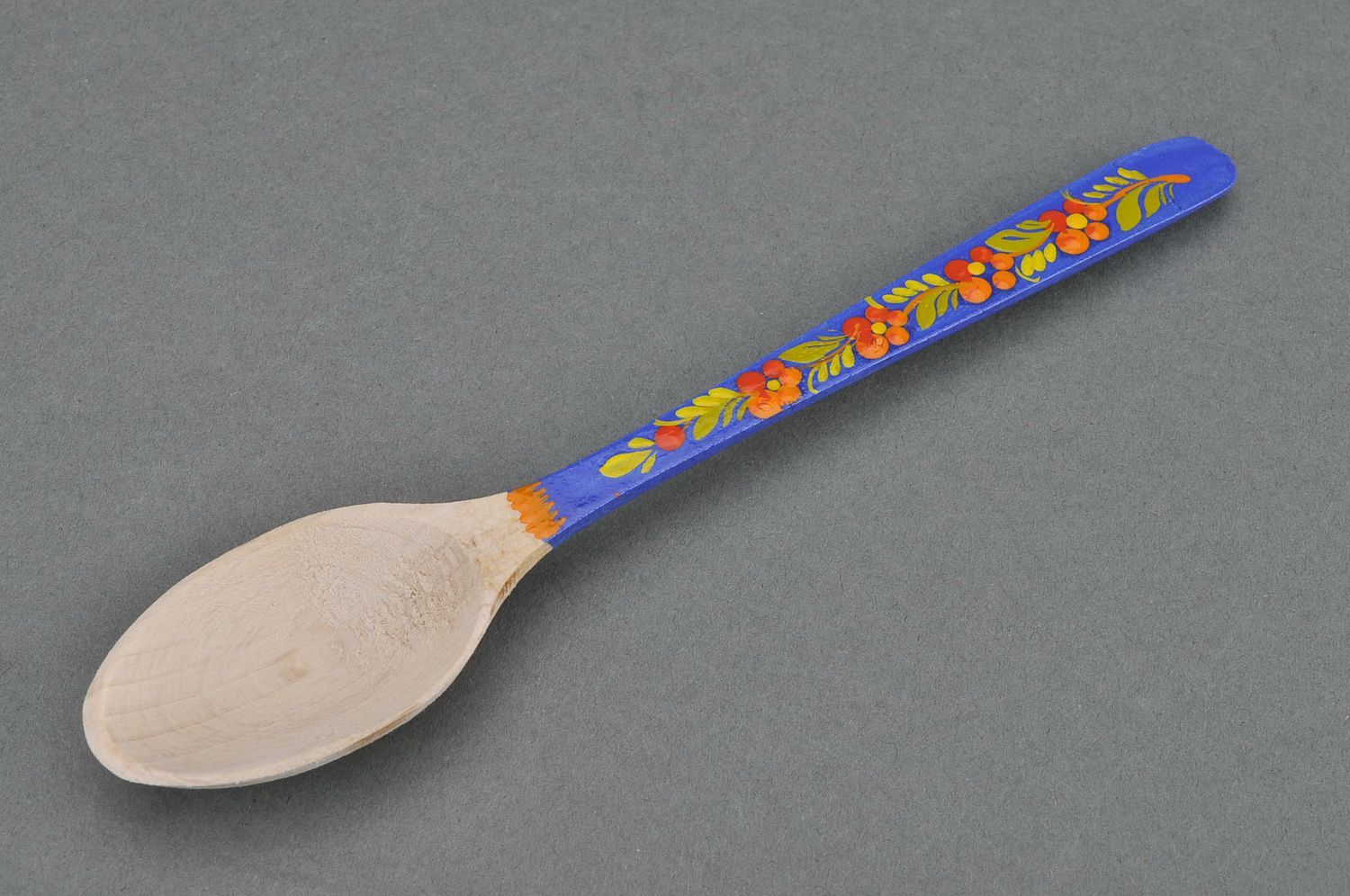 Wooden teaspoon with blue handle photo 1