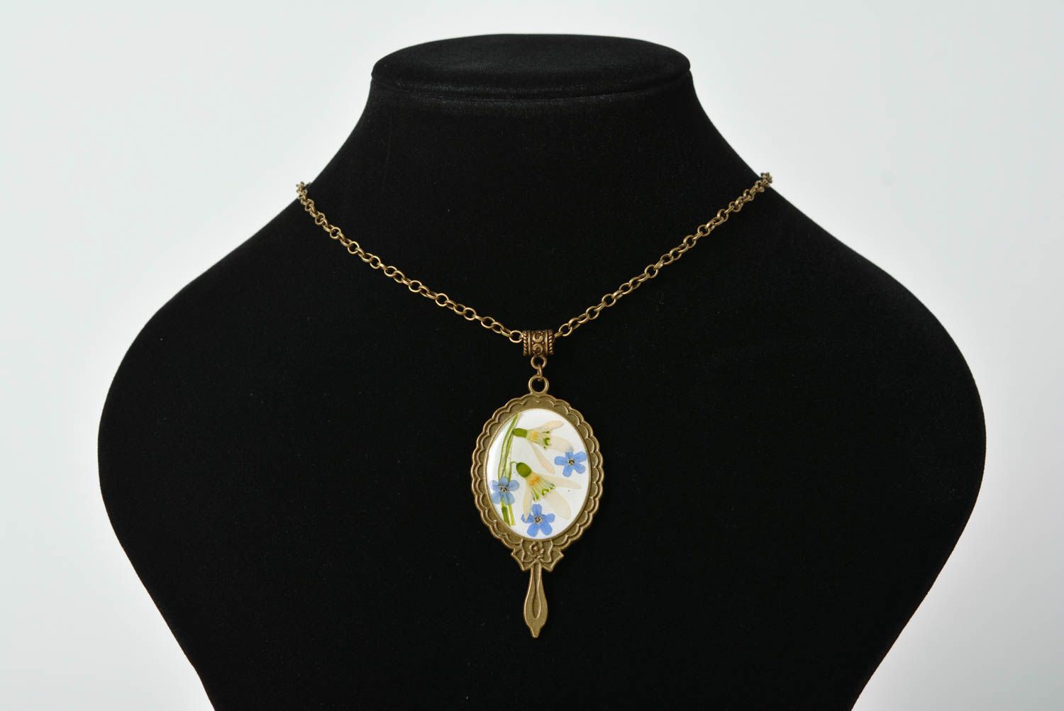 Beautiful handmade pendant with dried flowers and epoxy coating on metal chain photo 1