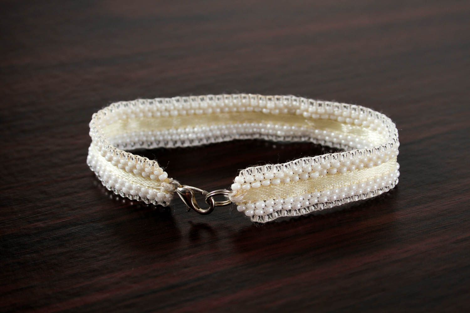 Line bracelet with white beads on textile base for girls photo 4