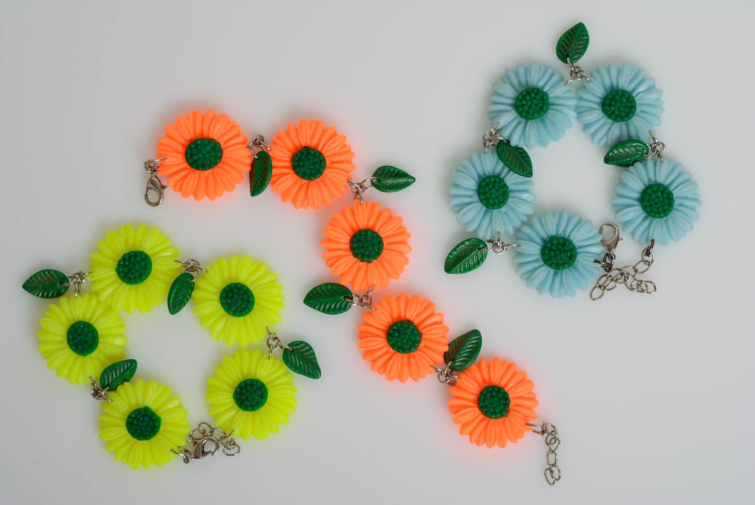 Set of handmade designer plastic flower bracelets 3 pieces yellow orange and blue photo 2
