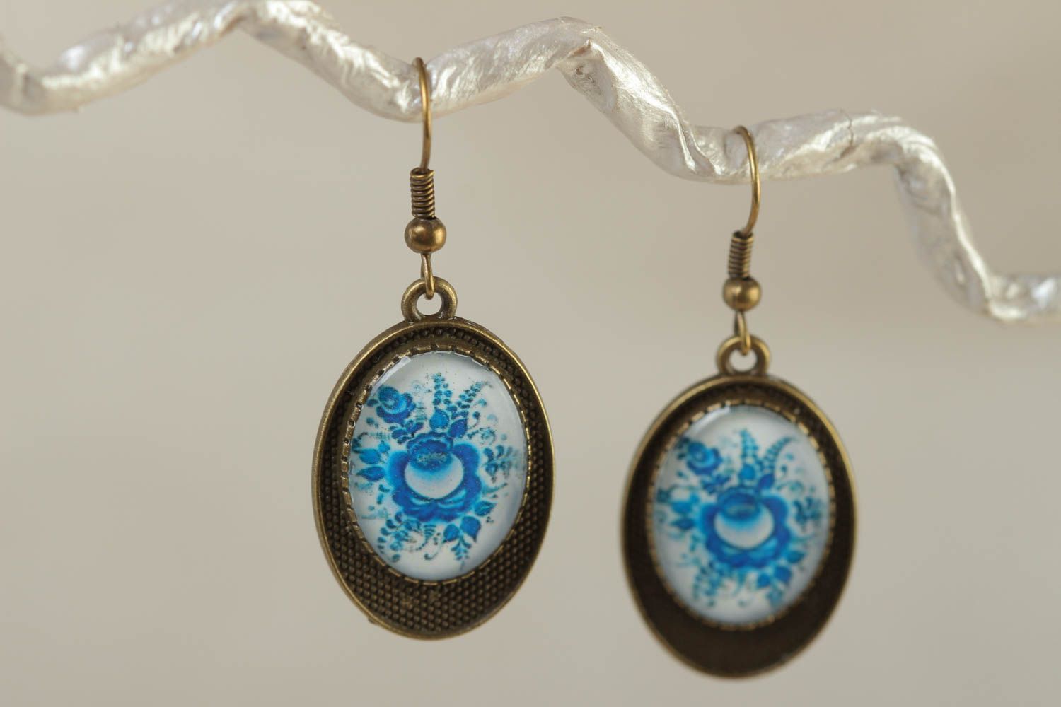 Handmade designer oval dangling earrings with metal basis and glass like glaze photo 1