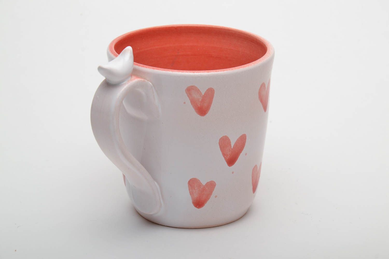 Ceramic handmade coffee cup with handle in white and orange color with hearts' pattern photo 3
