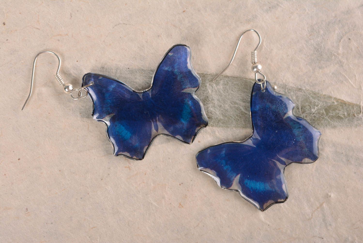 Unusual handmade blue butterfly shaped earrings coated with epoxy resin photo 1