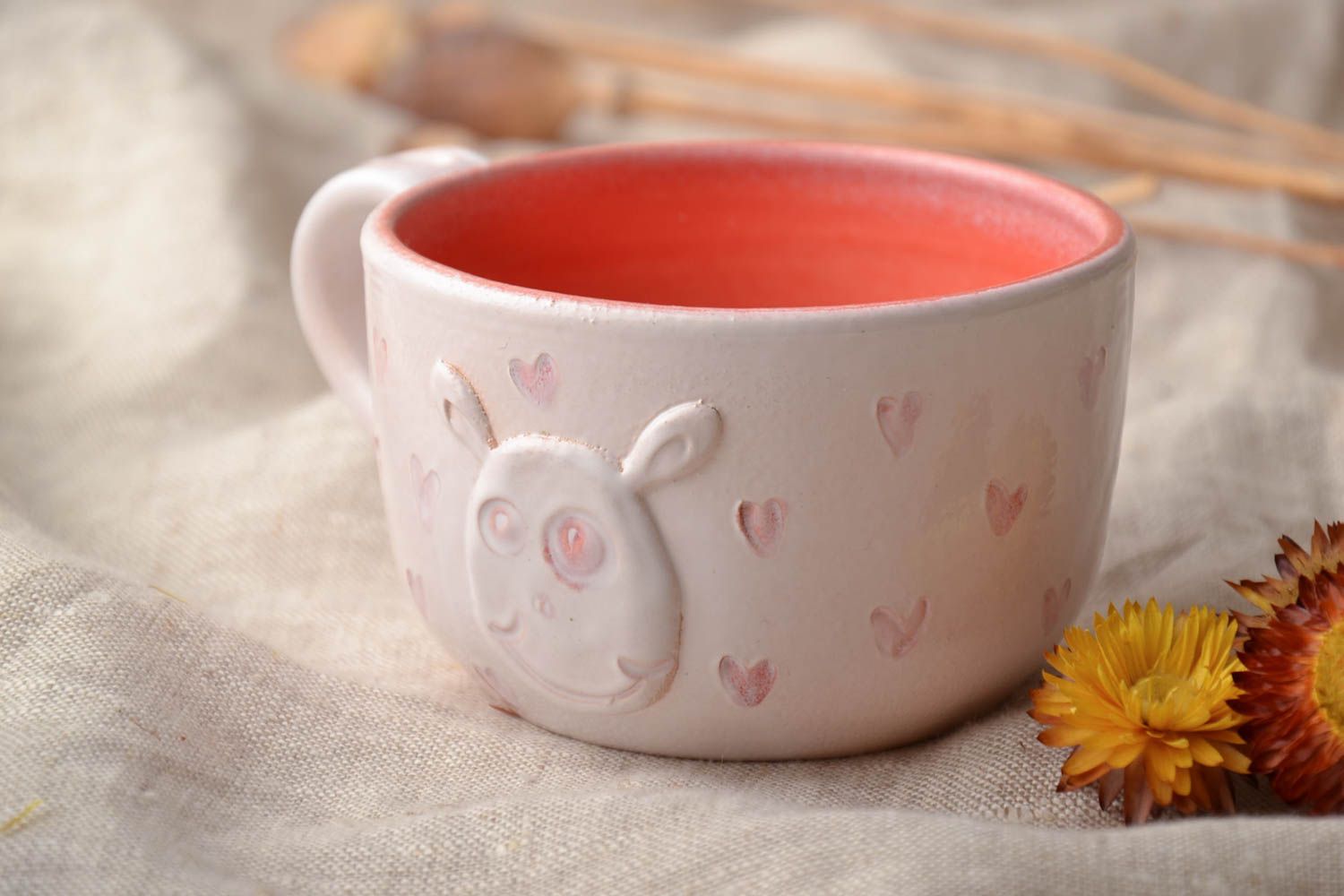 White and orange ceramic 5 oz teacup with molded rabbit and a handle photo 1