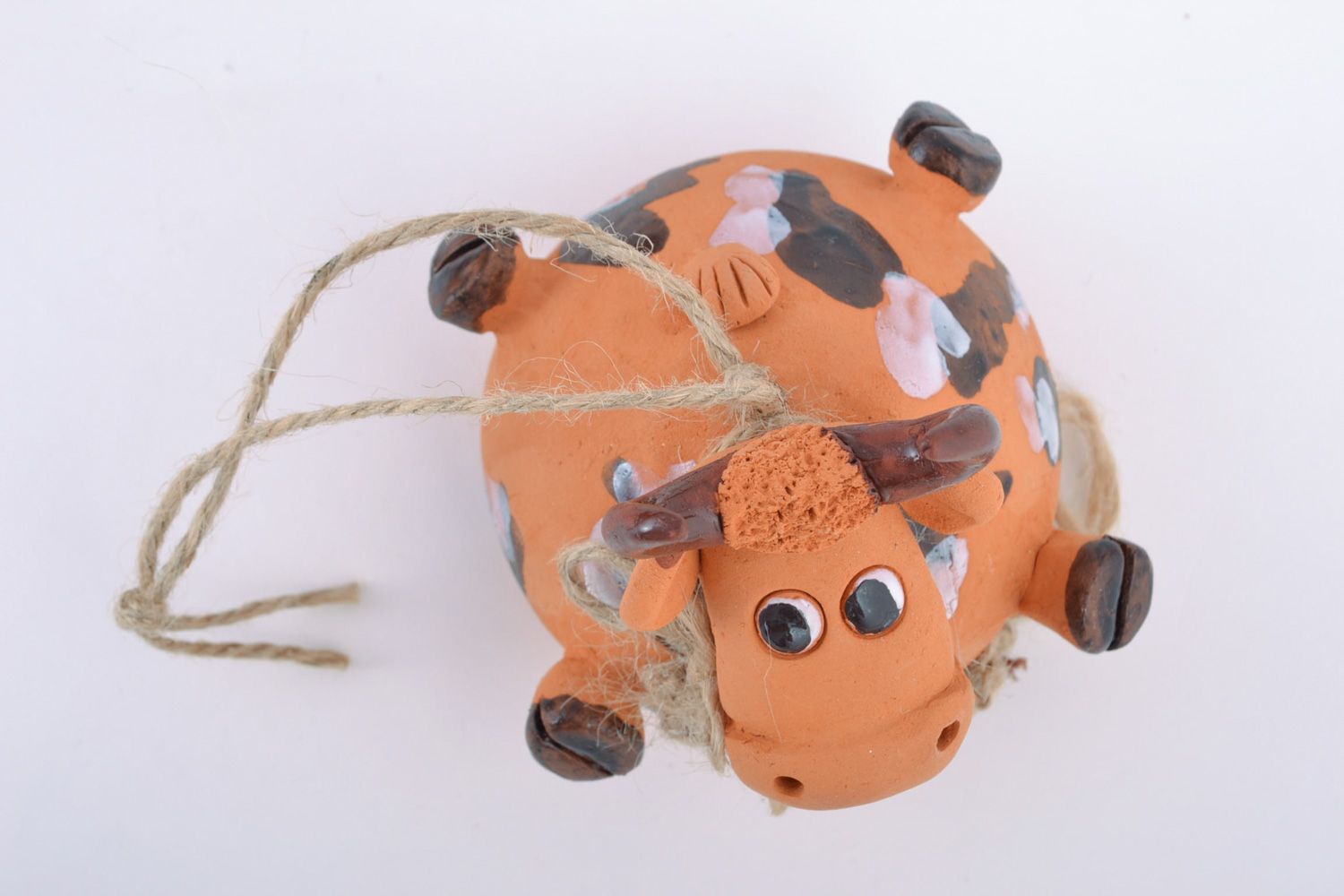 Funny handmade figured ceramic hanging bell in the shape of cow for interior decor photo 3
