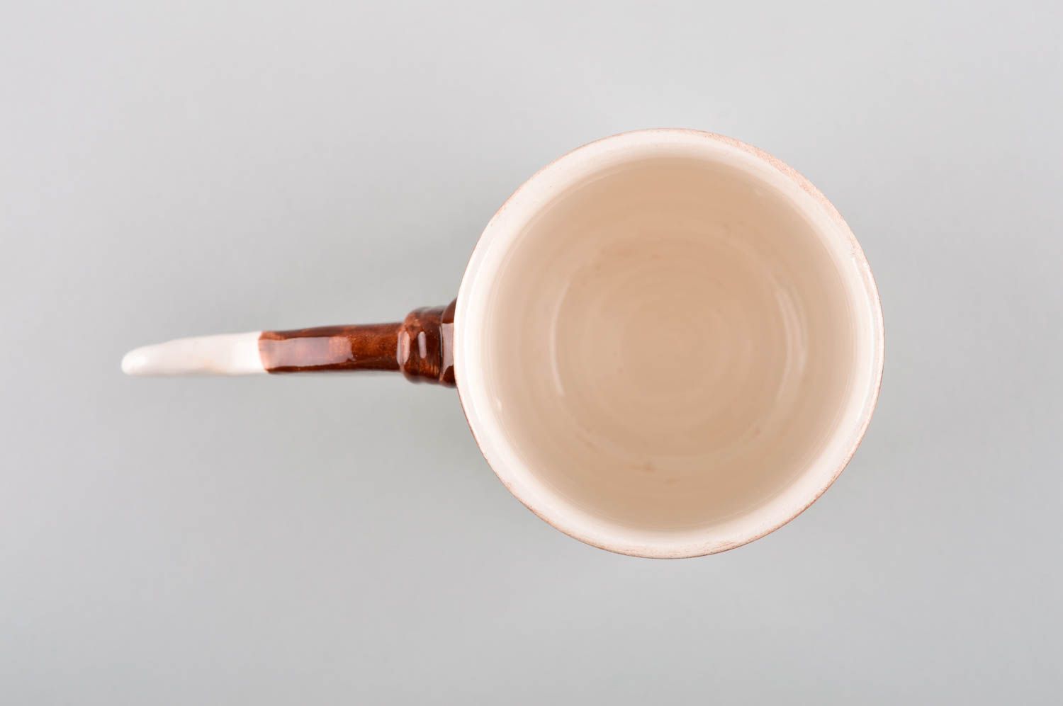Teacup in white and brown cherry colors and non-standard handle in the shape of a stick photo 4