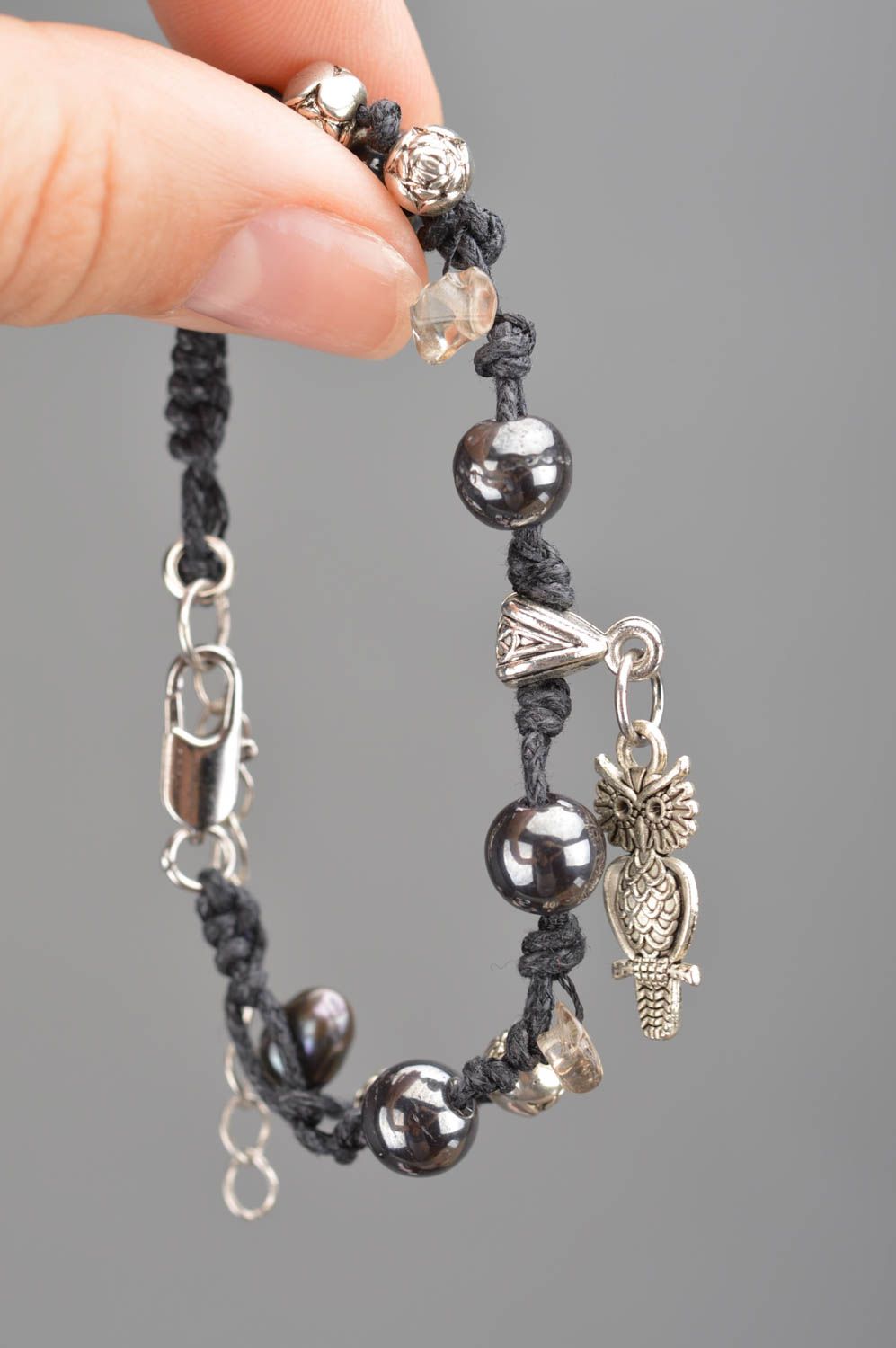 Handmade black woven bracelet made of threads beads and natural stones photo 3