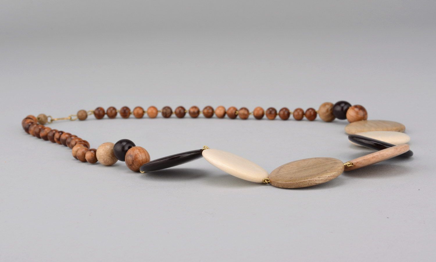 Necklace made of different kinds of wood with a clasp photo 1