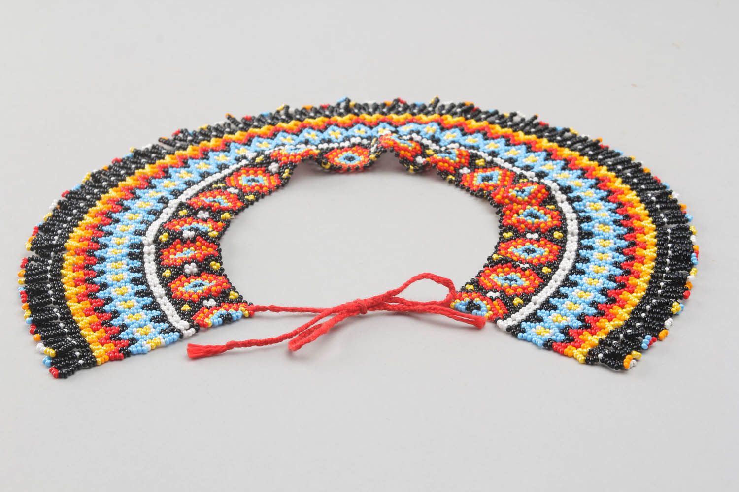 Broad beaded necklace with ornament photo 3