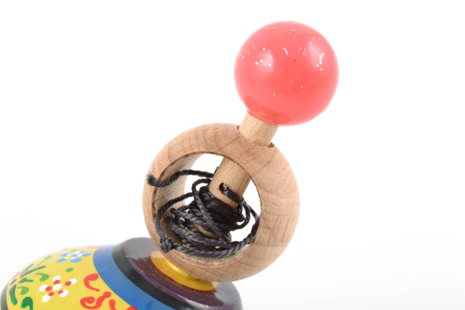 Colorful small handmade wooden spinning top with ring for dexterity development photo 4