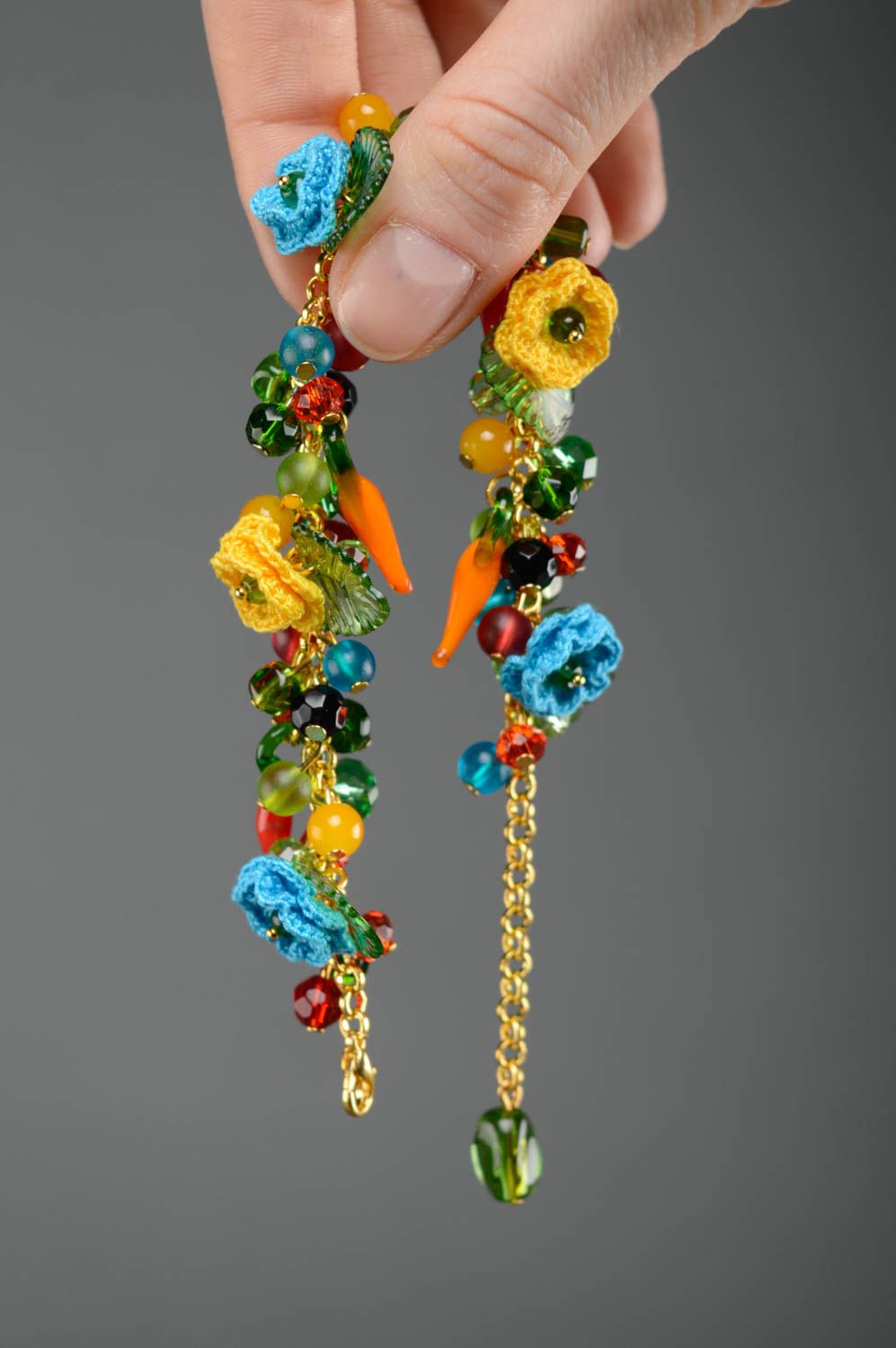 Bright beautiful crochet bracelet with charms and flowers photo 3