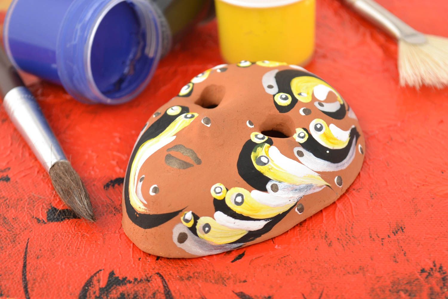 Handmade unusual painted wall pendant souvenir mask made of clay  photo 1