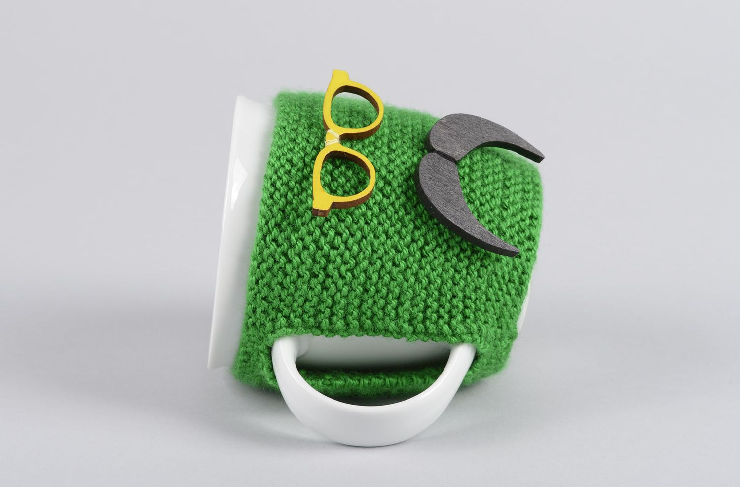 White ceramic porcelain teacup with handle and green man with mustache knitted cover photo 3