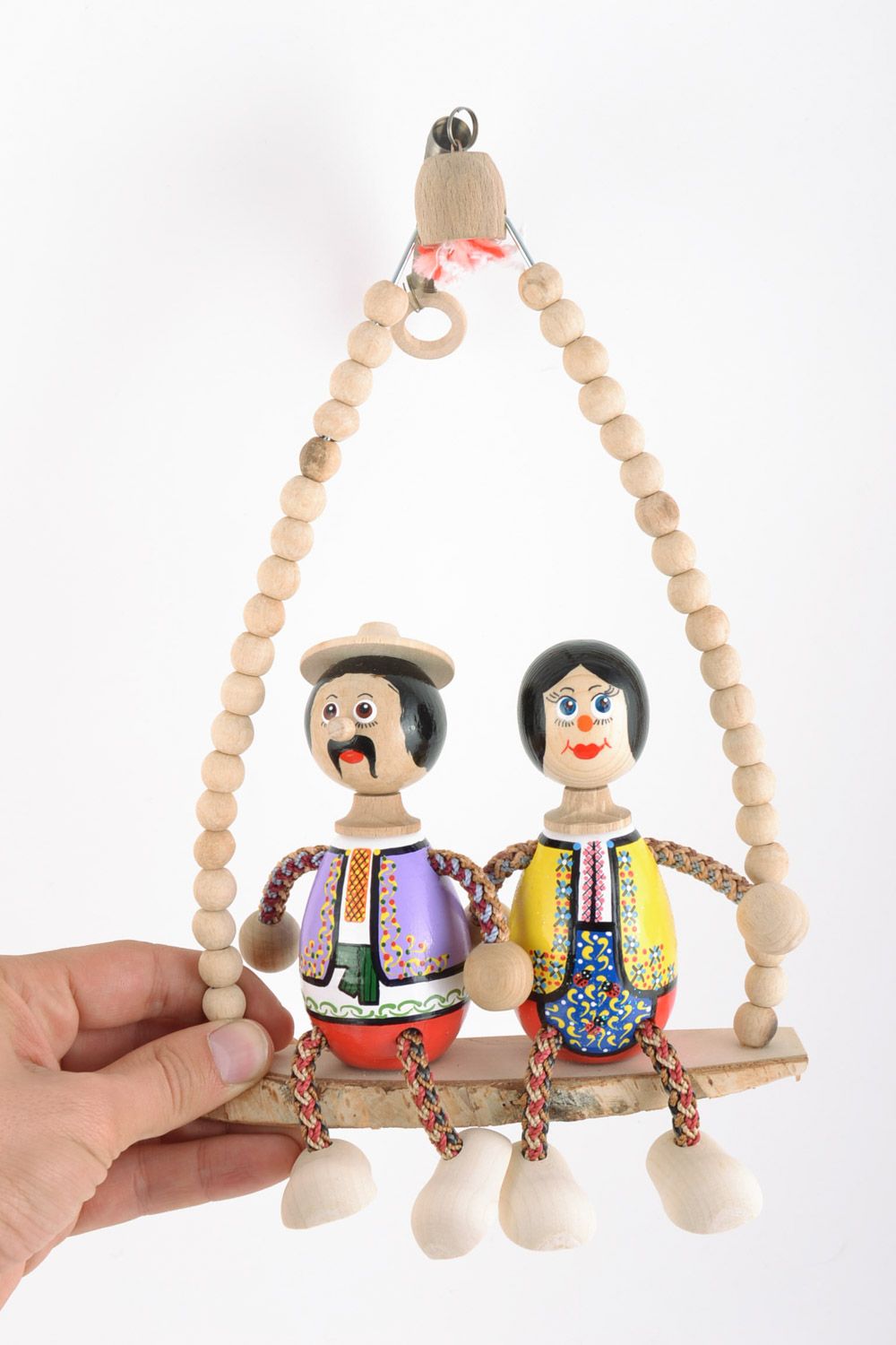 Öko Spielzeug aus Holz auf Sprungfeder mit Bemalung Liebespaar Handarbeit  foto 2