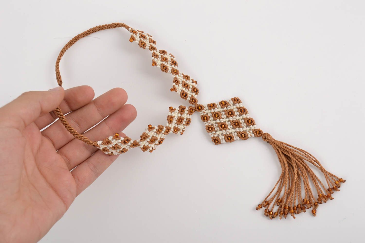 Handmade designer macrame necklace woven of threads with tassel white and beige photo 4