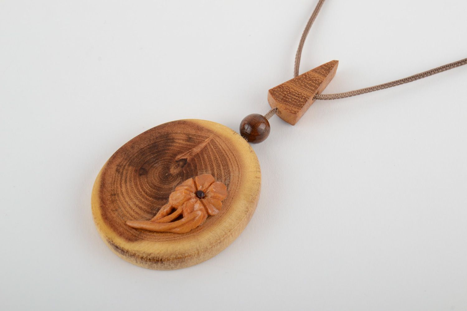 Large handmade varnished wooden neck pendant of oval shape with cord for women photo 3