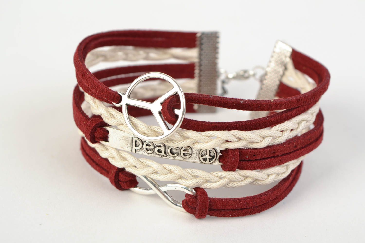 Unusual handmade woven suede bracelet with charms in the shape of various signs photo 3