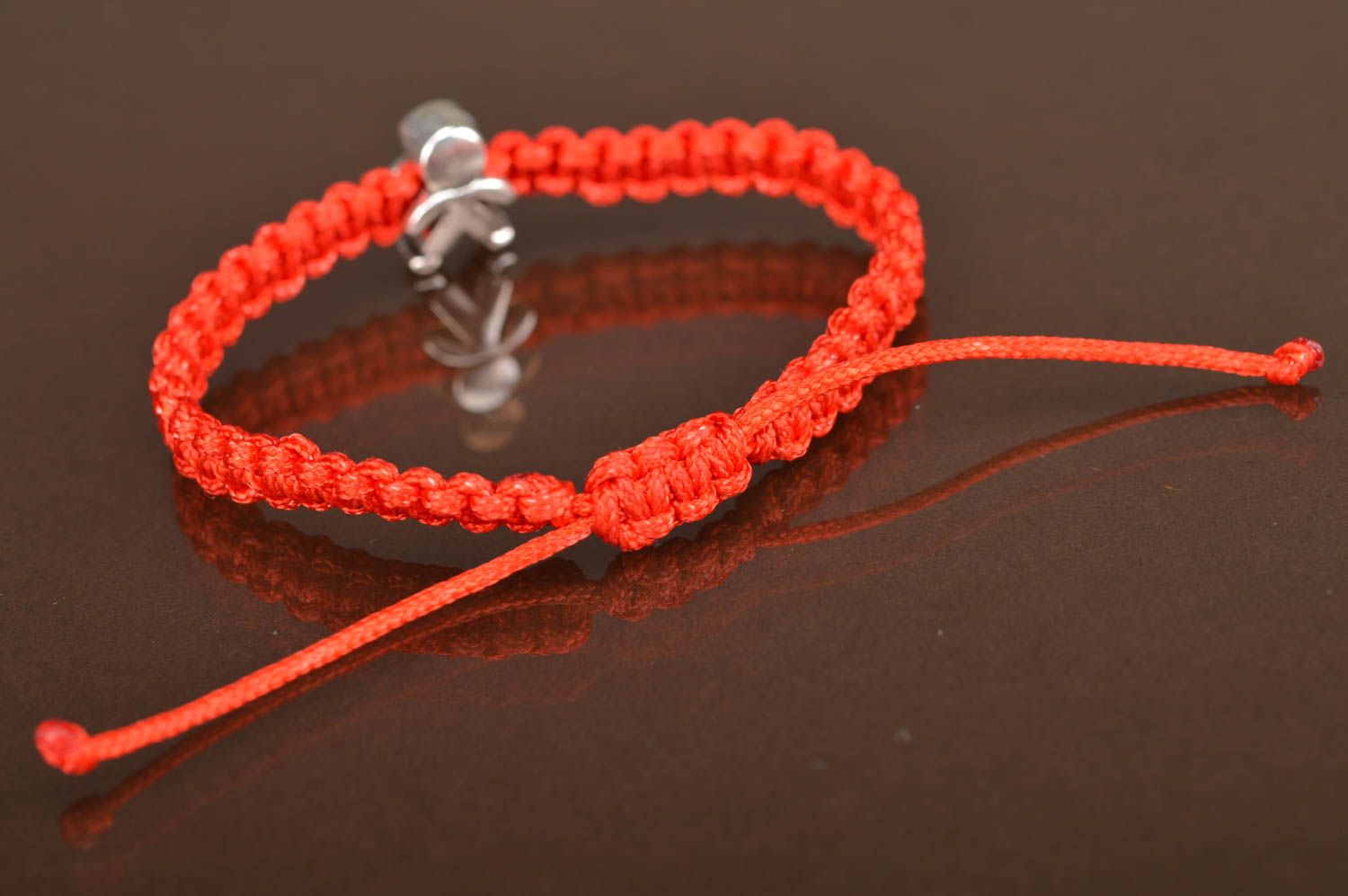 Thin woven stylish unusual red handmade bracelet made of textile laces Man photo 4
