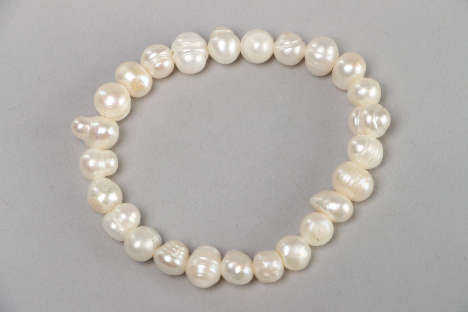 Stylish handmade stretch wrist bracelet with white fresh water pearls for women photo 1