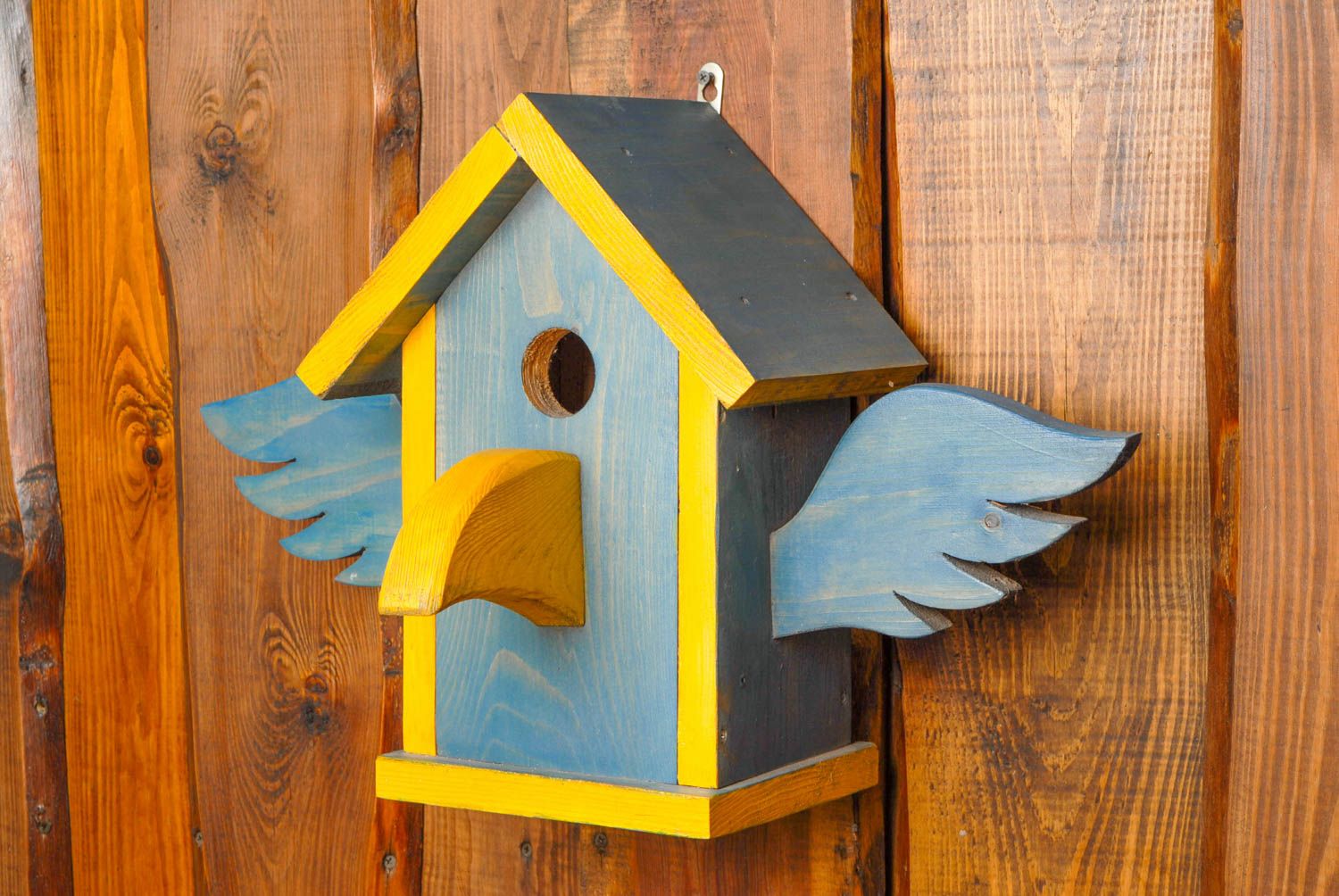 Wooden birdhouse painted with facade dyes photo 1