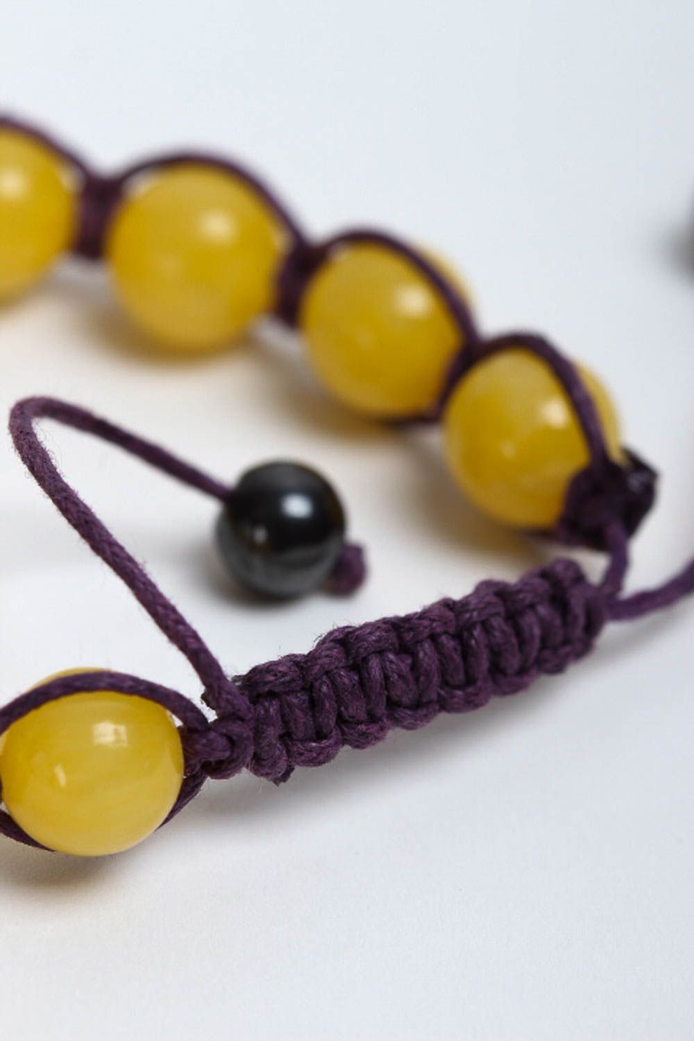 Yellow hematite and calcite beads strand bracelet on black cord  photo 4