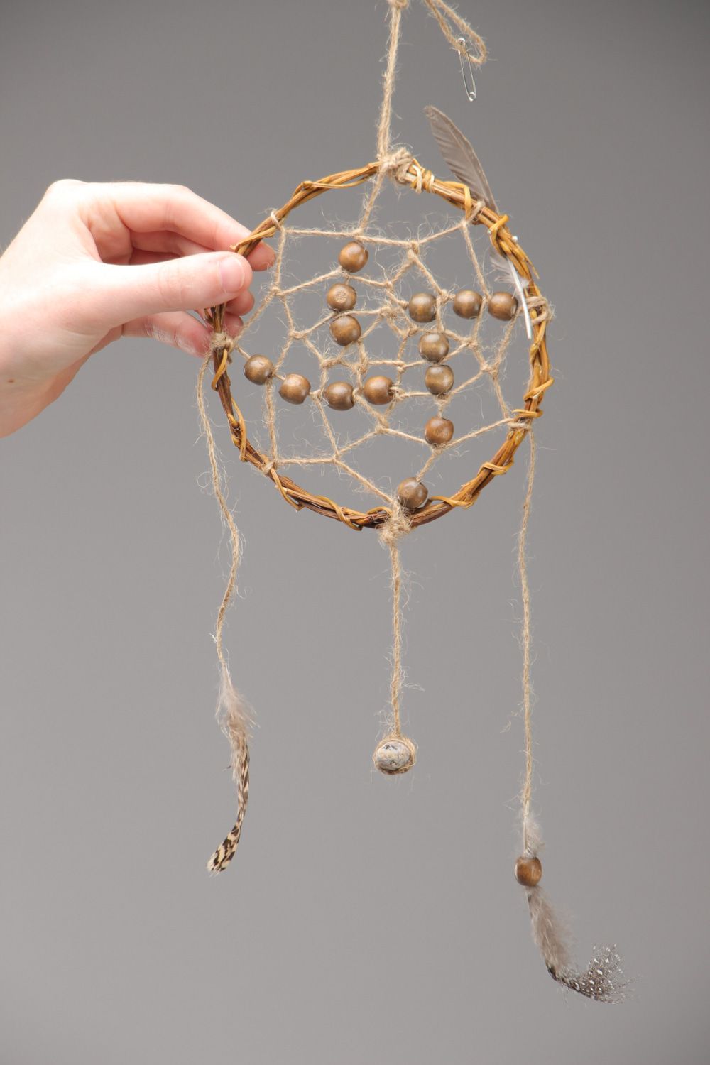 Brown homemade dreamcatcher wall hanging with pine wood beads feathers and stones  photo 5