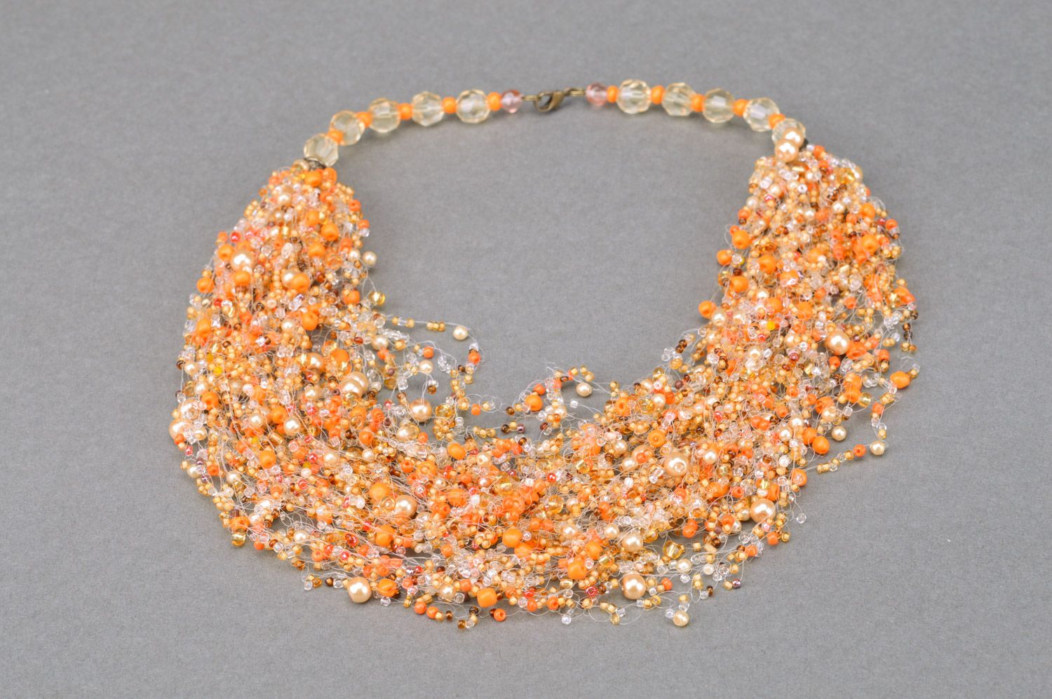 Unusual handmade long airy beaded necklace of orange color photo 2