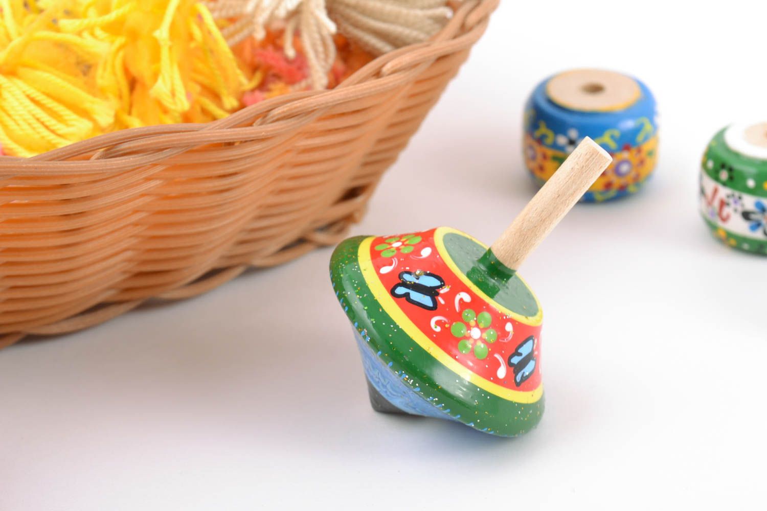 Green handmade wooden spin top painted with eco dyes educative children's toy photo 1