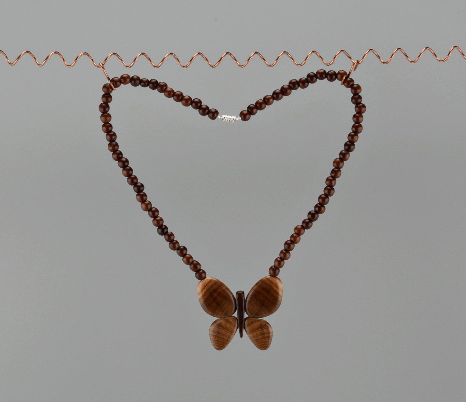 Wooden bead necklace with butterfly photo 2