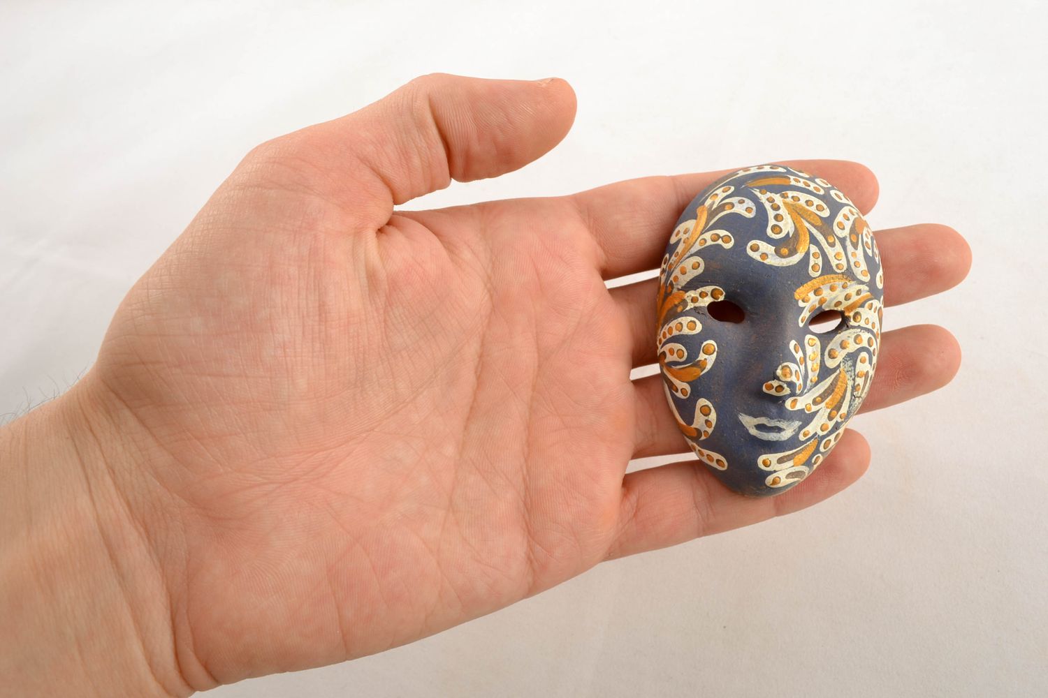 Blue fridge magnet in the shape of souvenir mask photo 1