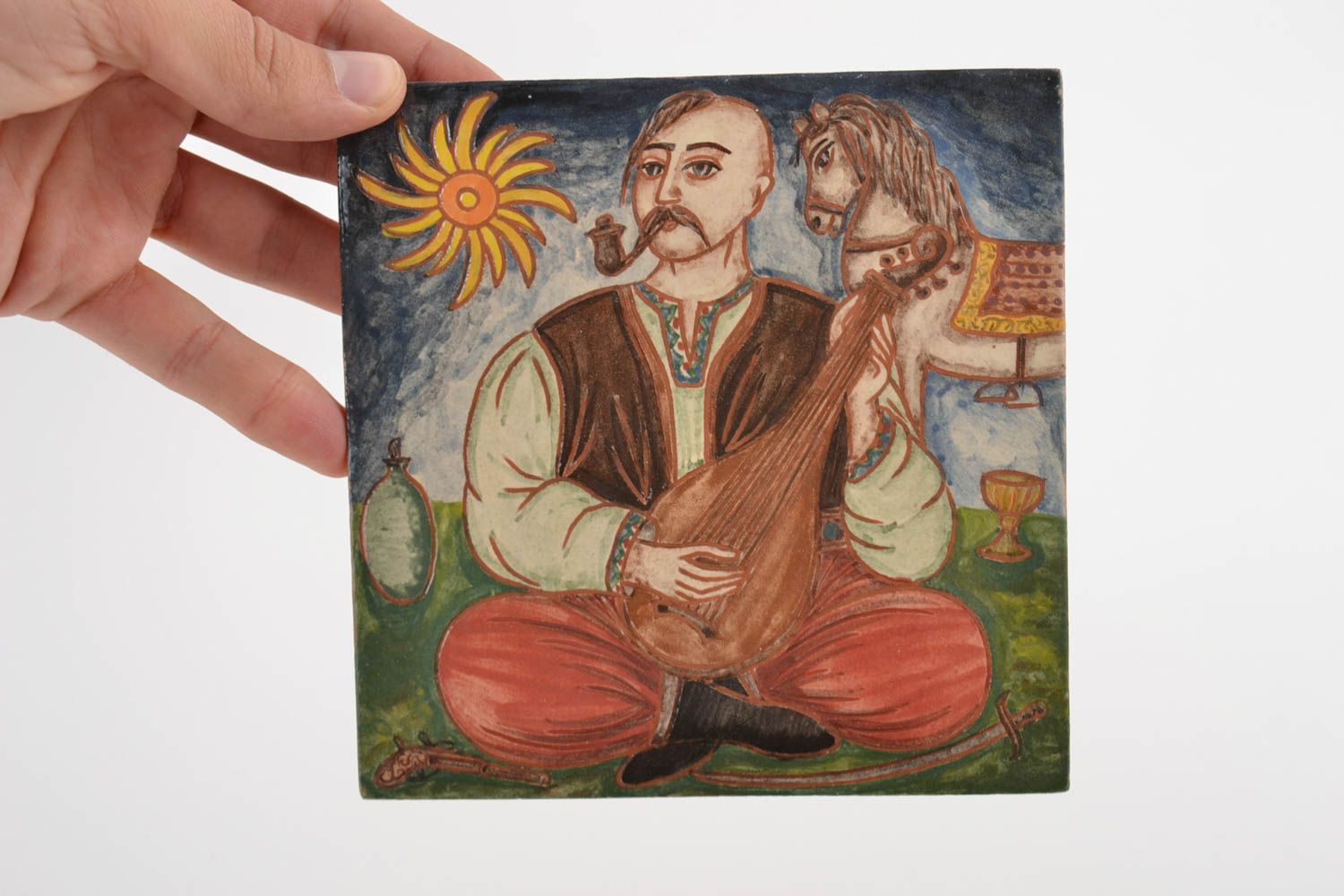 Handmade tile molded of clay painted with colorful engobes in ethnic style  photo 2