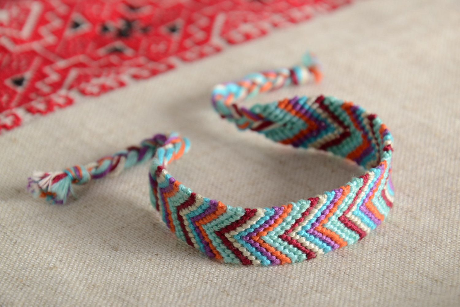 Handmade stylish friendship wrist bracelet woven of colorful embroidery floss photo 1