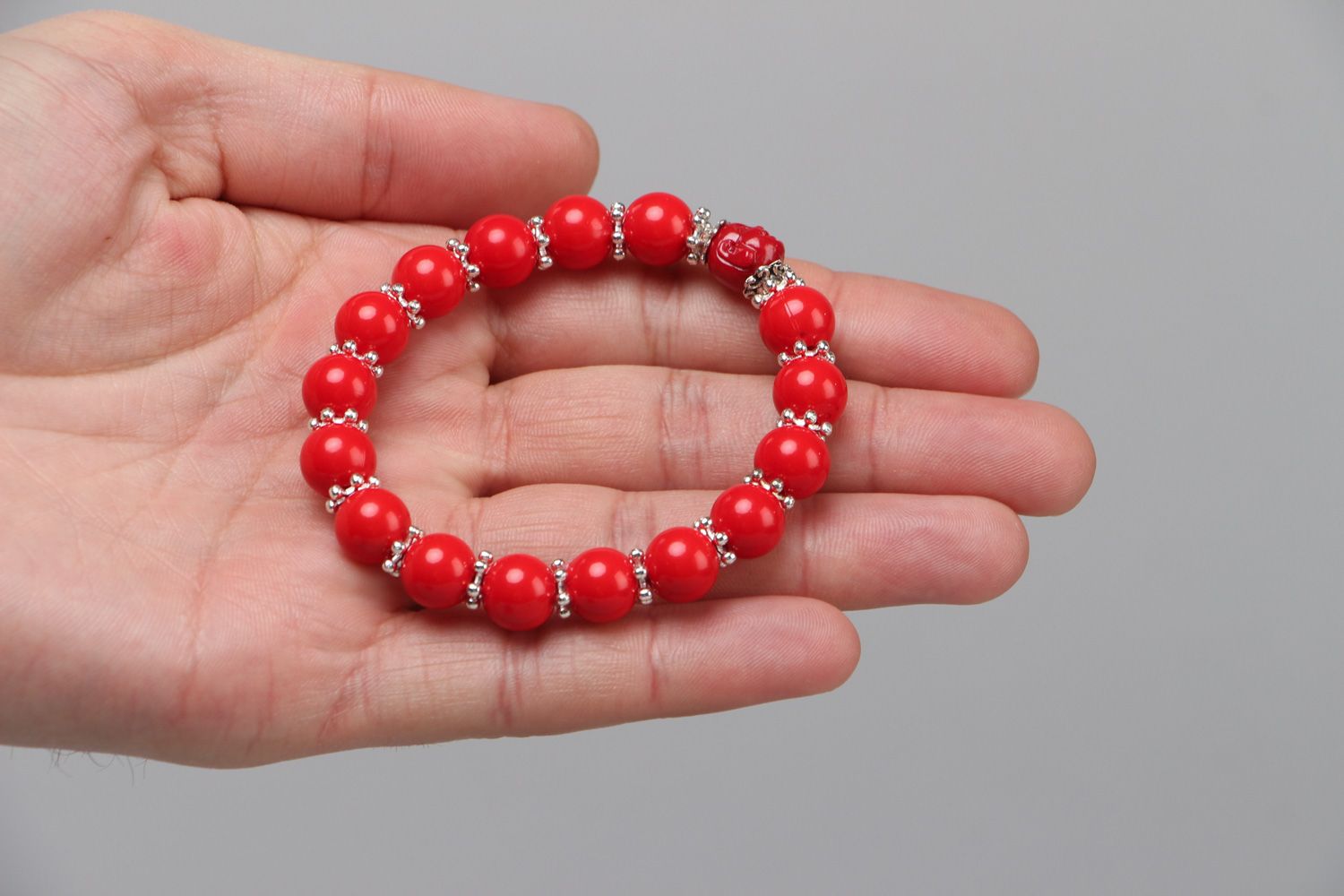 Handmade laconic stretch wrist bracelet with plastic beads of red color for women photo 3