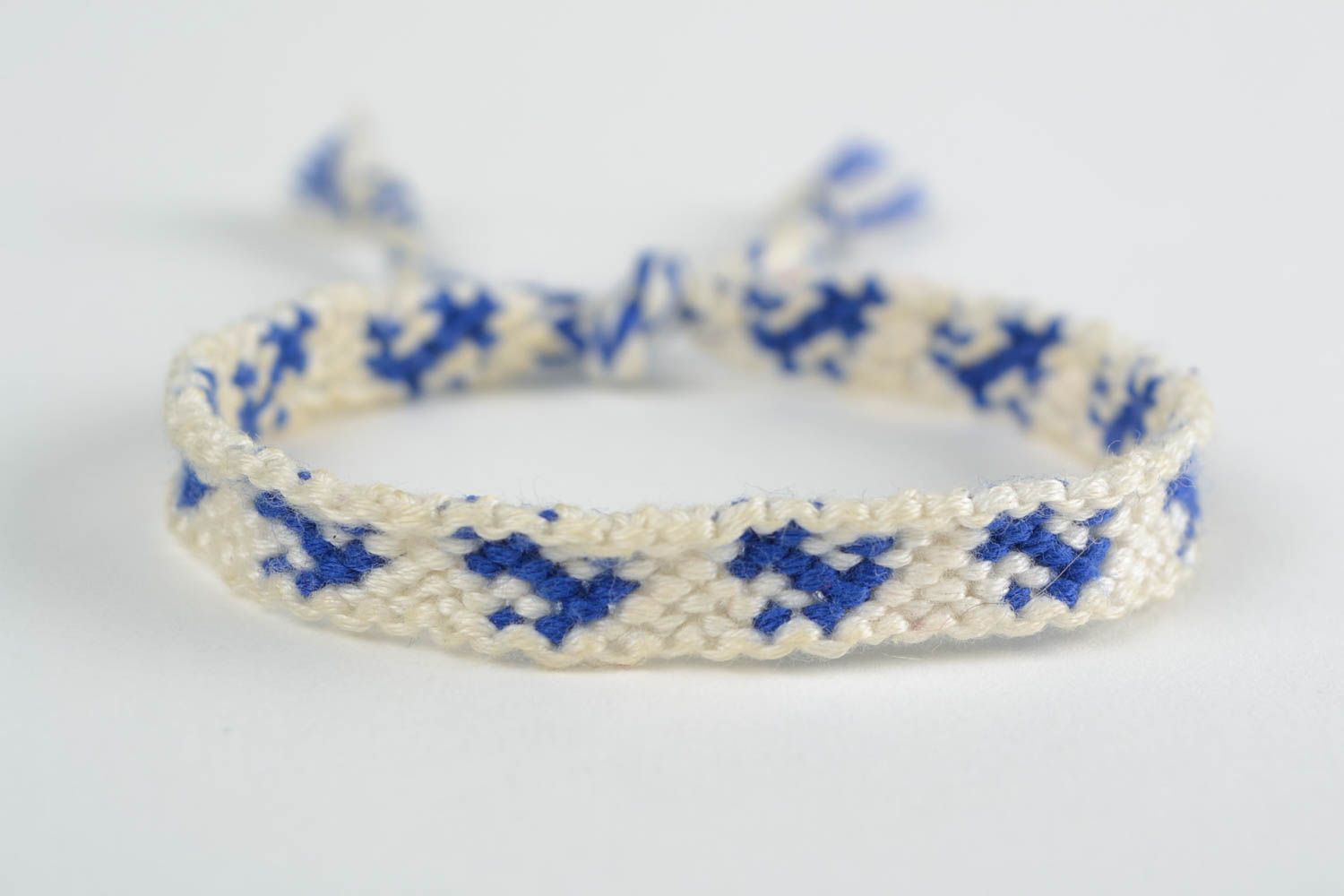 Handmade thin white and blue friendship wrist bracelet woven of threads with tie photo 3