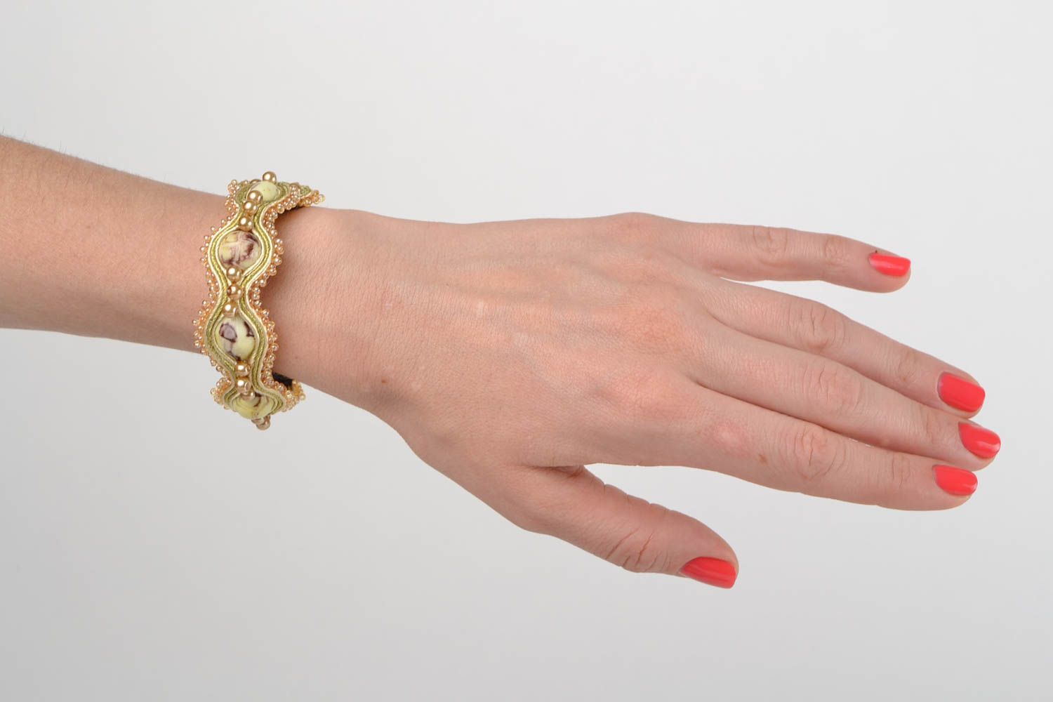 Handmade designer beige soutache wrist bracelet with polymer clay elements photo 1