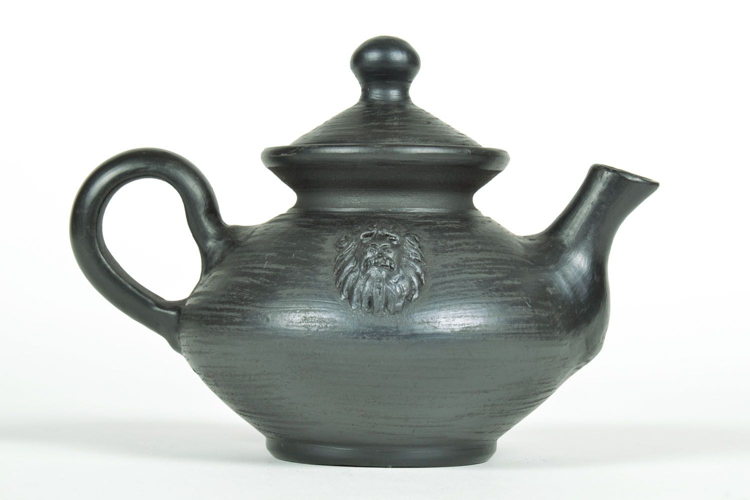 Schwarze Teekanne aus Keramik foto 4