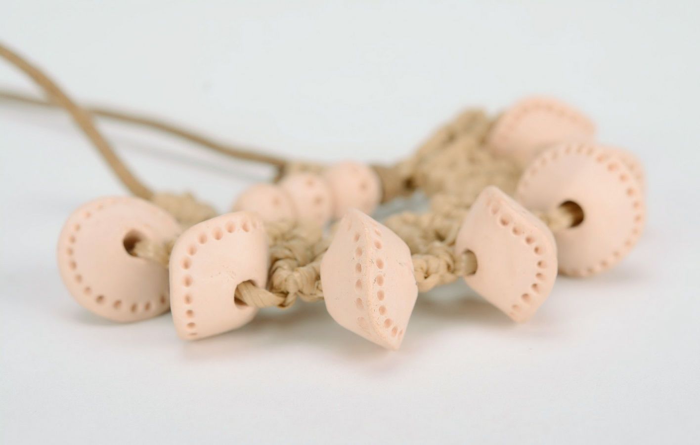 Beads made of white clay photo 2