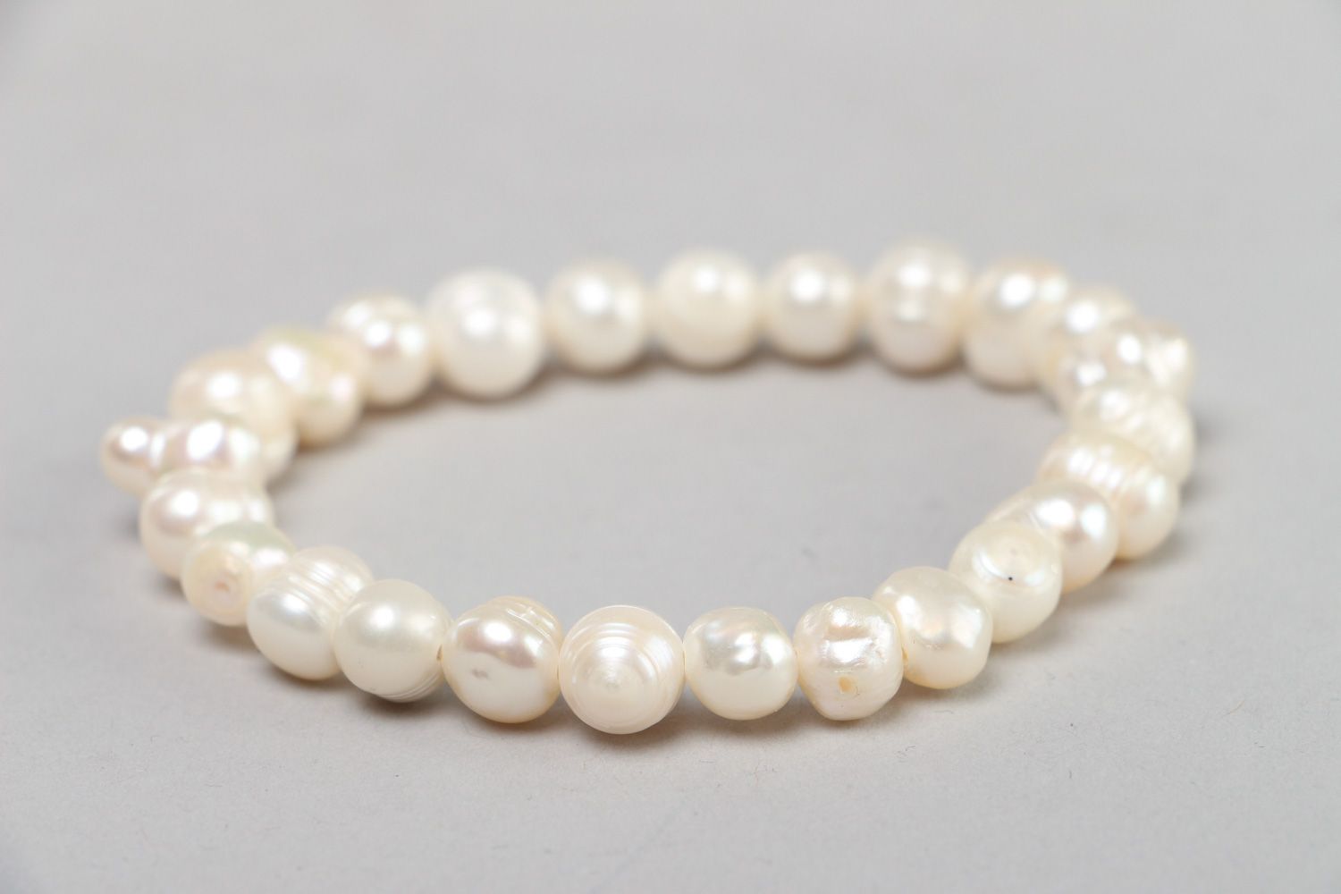 Stylish handmade stretch wrist bracelet with white fresh water pearls for women photo 2