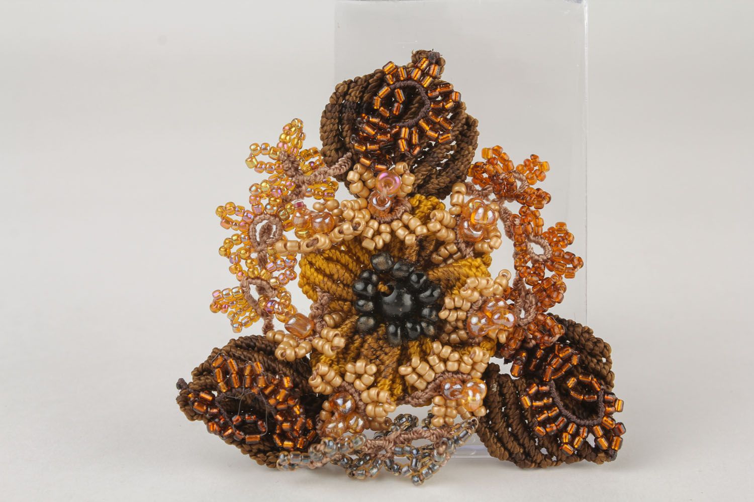Beautiful brooch made of threads and beads photo 2