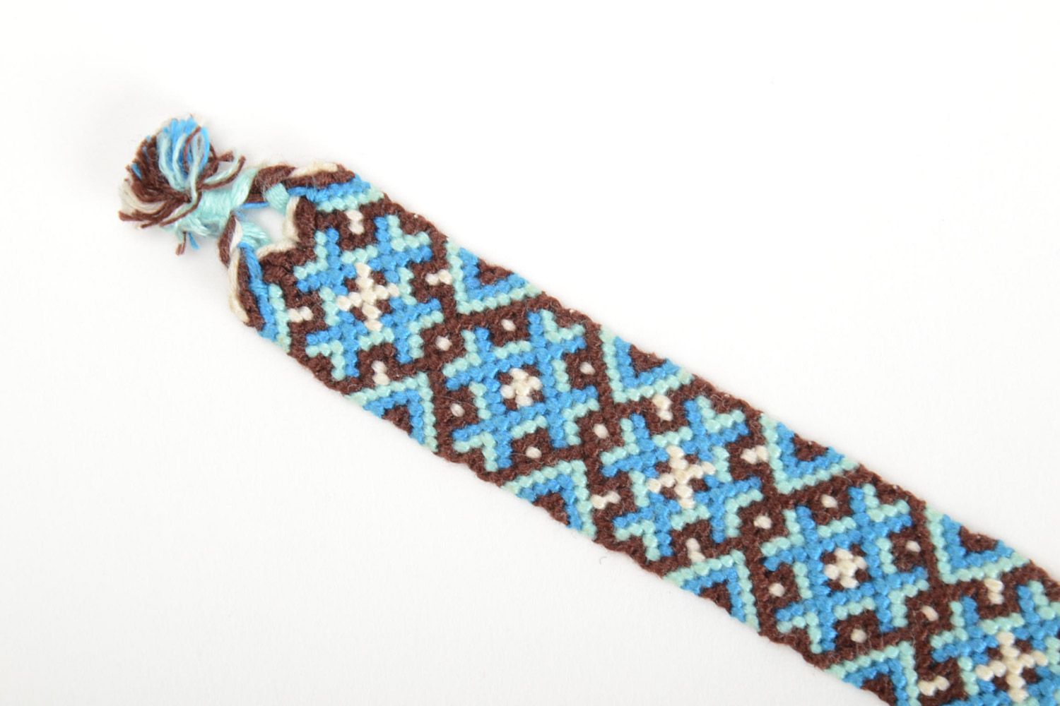 Handmade friendship wrist bracelet woven of threads with blue and brown ornament photo 4