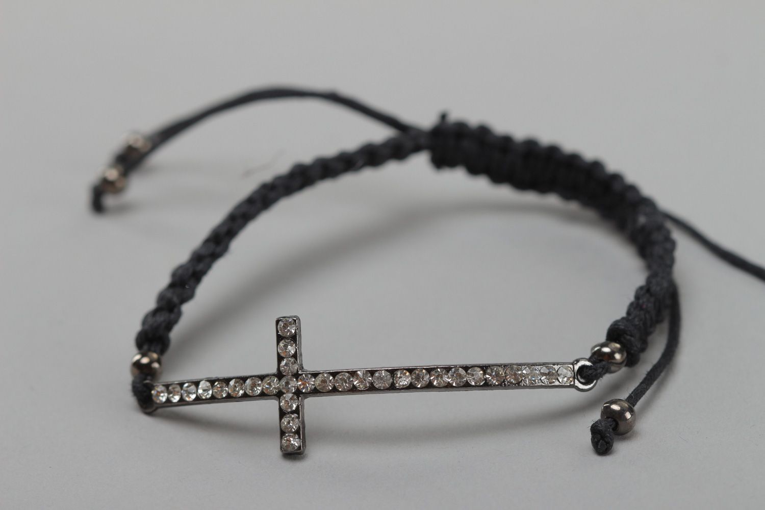 Handmade friendship bracelet is woven of cord with metal cross and rhinestones photo 2