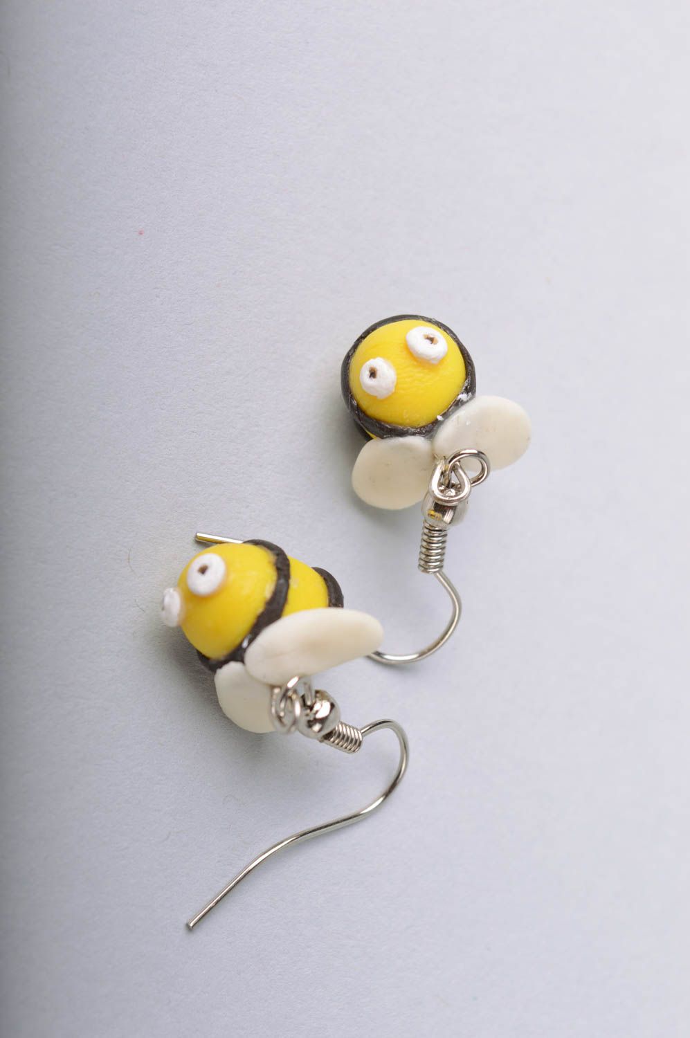 Handmade funny small dangle earrings with cold porcelain yellow bees photo 1